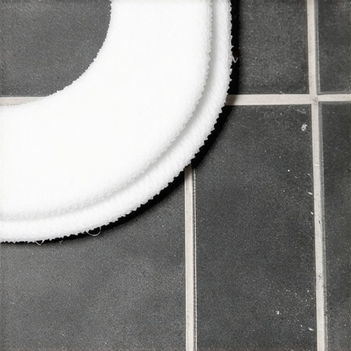Cleaning Epoxy Grout Haze with Scrub Pad Close up of white scrub pad removing epoxy haze from grey tile.